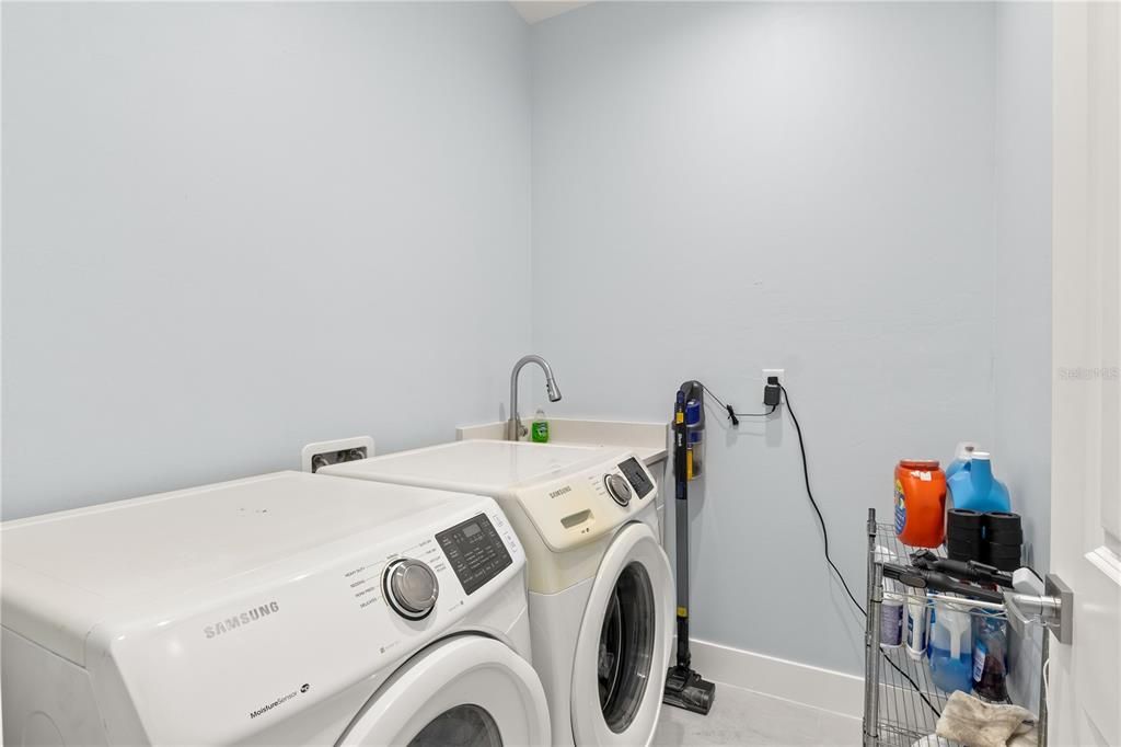 Laundry room featuring separate washer and dryer