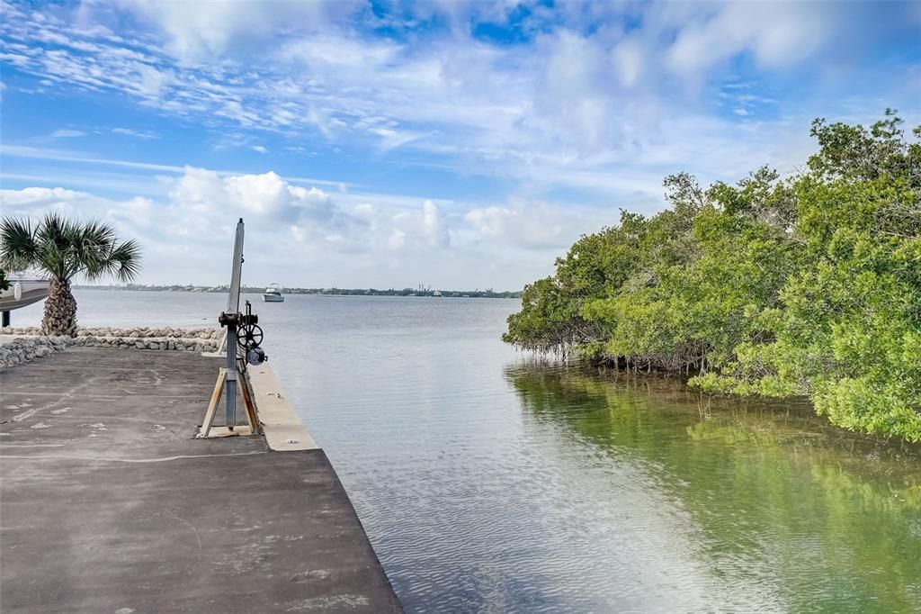 Saltwater Canal borders west side of property. To the left of canal is State Park "Lemon Bay Park"