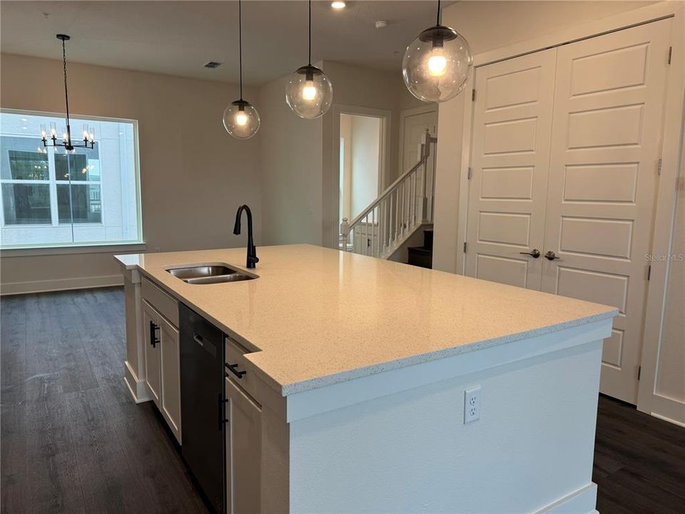 KITCHEN IN FOREFRONT, DINING & POWDER ROOM REAR