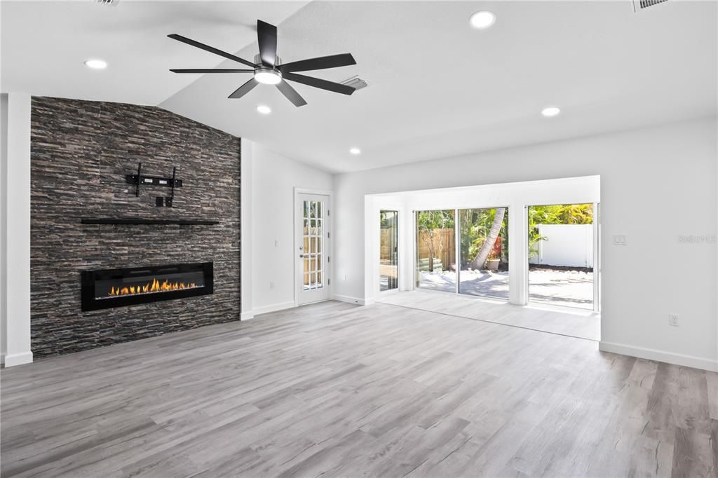 STUNNING statement wall with custom tile and electric fireplace!