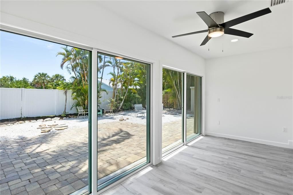 Looking out to the back yard with beautiful landscaping, fully fenced and a large storage shed!