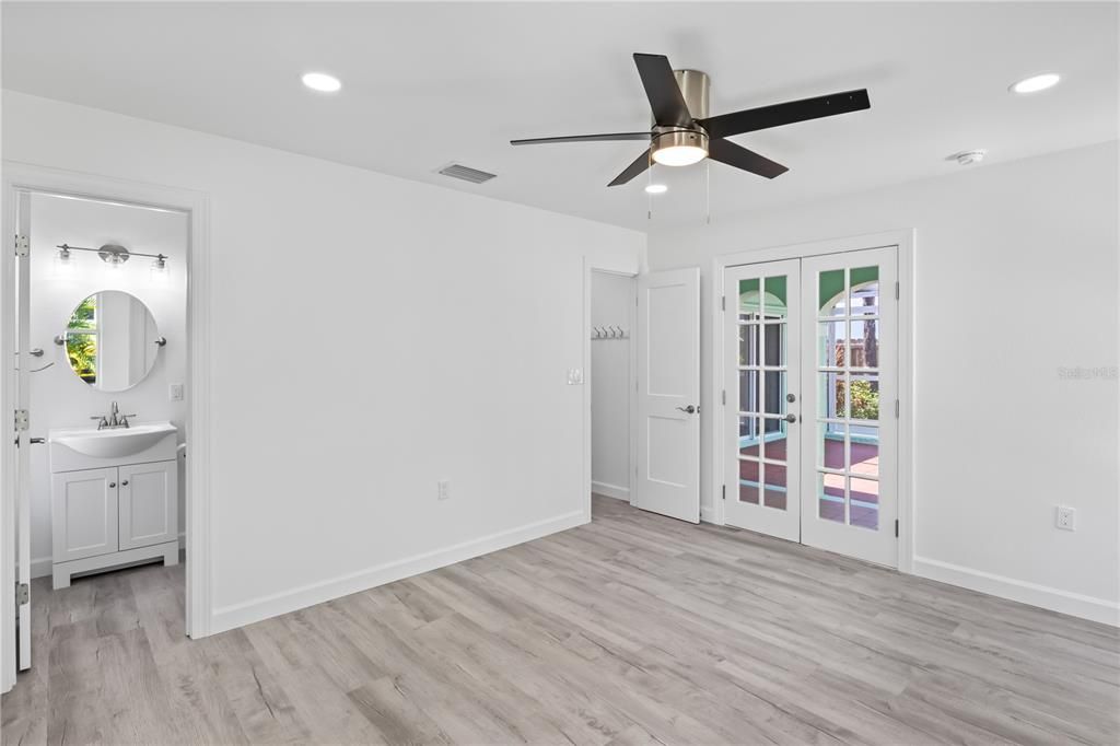 Double door entryway and an additional access as well as a private bathroom and closet! A perfect guest room or private suite /office / studio / exercise room!