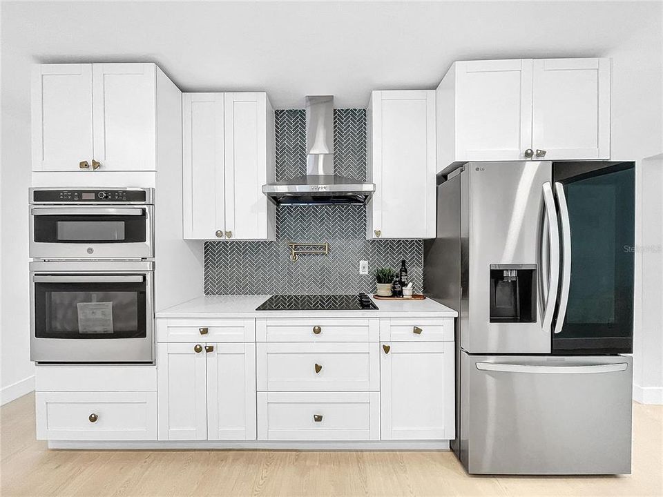 New appliances, quartz countertops, kitchen exhaust fan vents outside