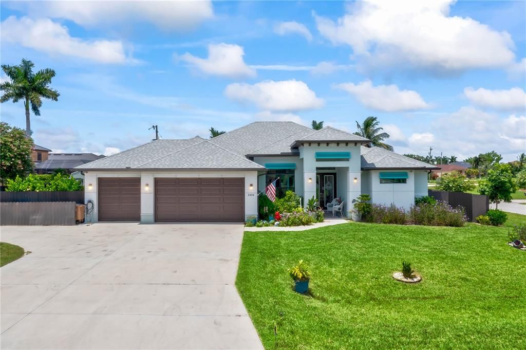 Corner lot with extensive driveway, Bahama shutters, corbels and so much more! Located just off Chiquita and close to Cape Coral Parkway and all the restaurants and night life!