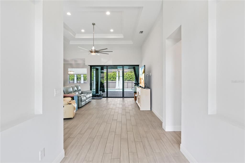 Entry way looking in to the main living area and out to the pool!