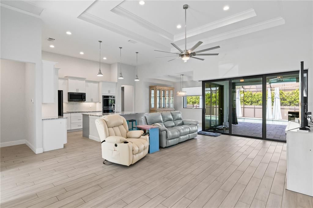 Super large living room with double tray ceilings, 90 degree sliders to the back patio and TONS of space and charm!