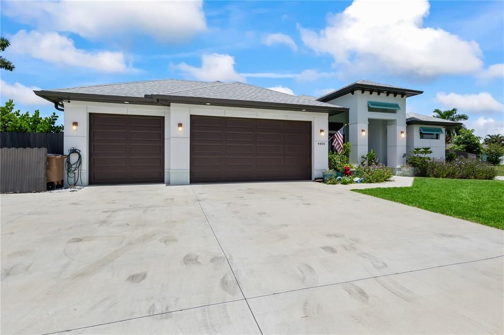 Welcome home to this almost new TRIPLE LOT that is fenced - Three bedrooms and a den, 3 car garage, pool and spa - customized in every way.