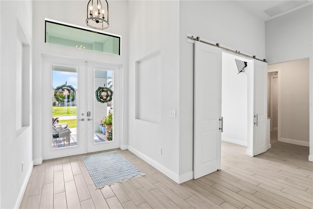 Beautiful double door with transom window welcome you into your new home! Ceramic tile flooring with neutral color palette and custom features throughout this beauty of a home!