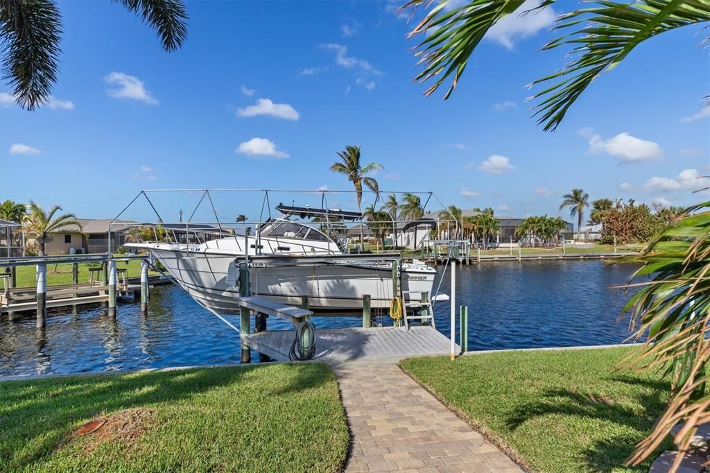 Boat dock with electric boat lift