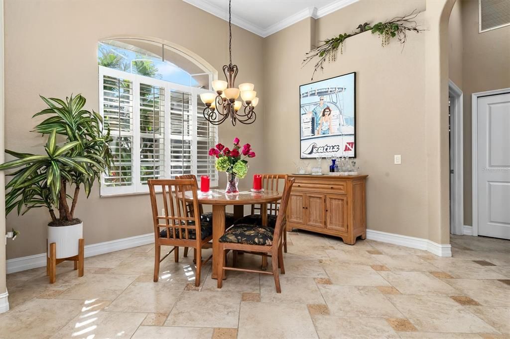 Beautiful travertine flooring with plantation shutters