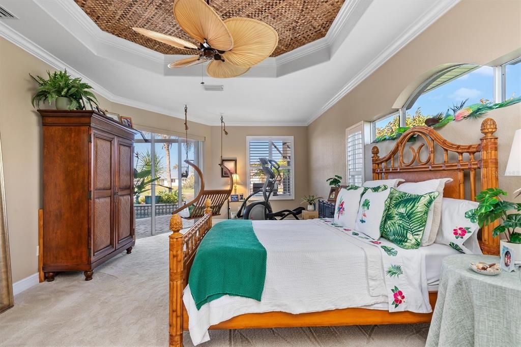 Lovely view of pool and canal from a hanging swing in bedroom