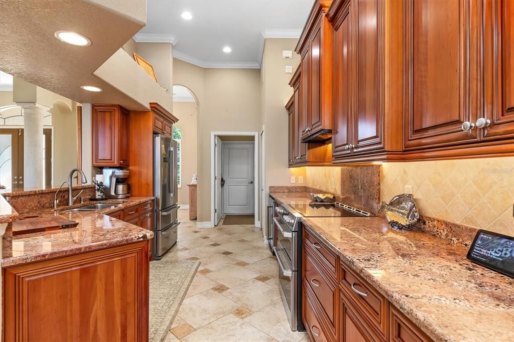 Solid Cherry wood cabinets in perfect condition, granite countertops, under and over counter lighting