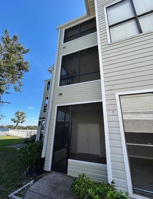 Exterior Side Exit of Screened Lanai/Porch to Lake