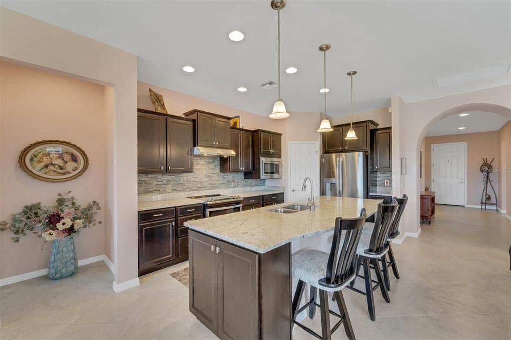 Stainless Appliances and Mocha Cabinetry with Granite