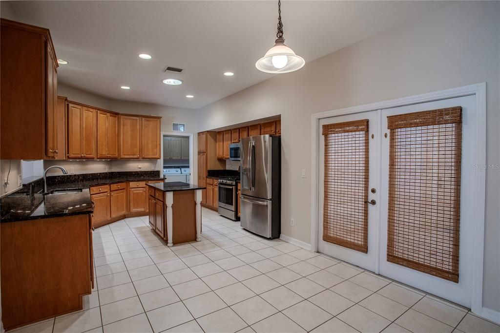 Kitchen and Dinette.  Table can sit under light in front of French Doors to patio. Great place for grilling!