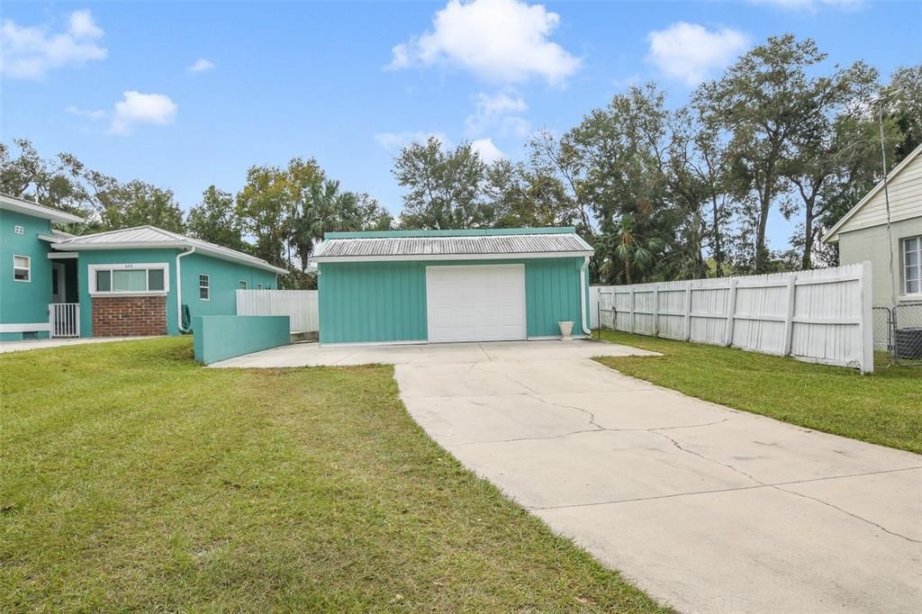 There is also a detached garage with 500 sq ft under A/C for the perfect workshop or hobby space and a large shed in the backyard provides additional storage.