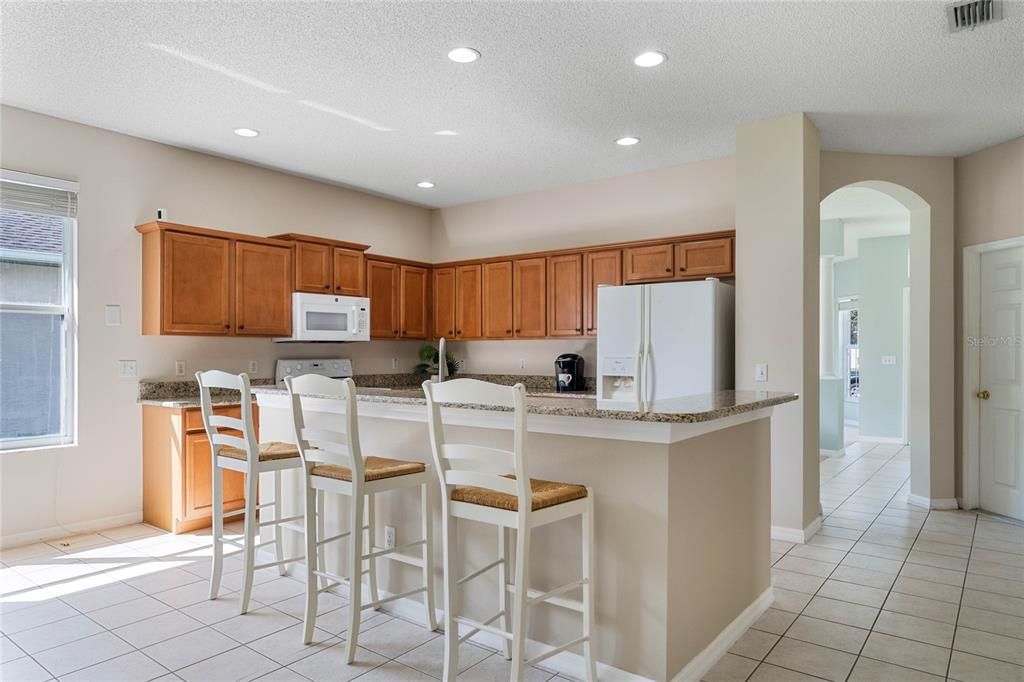 Kitchen with bar seating at island