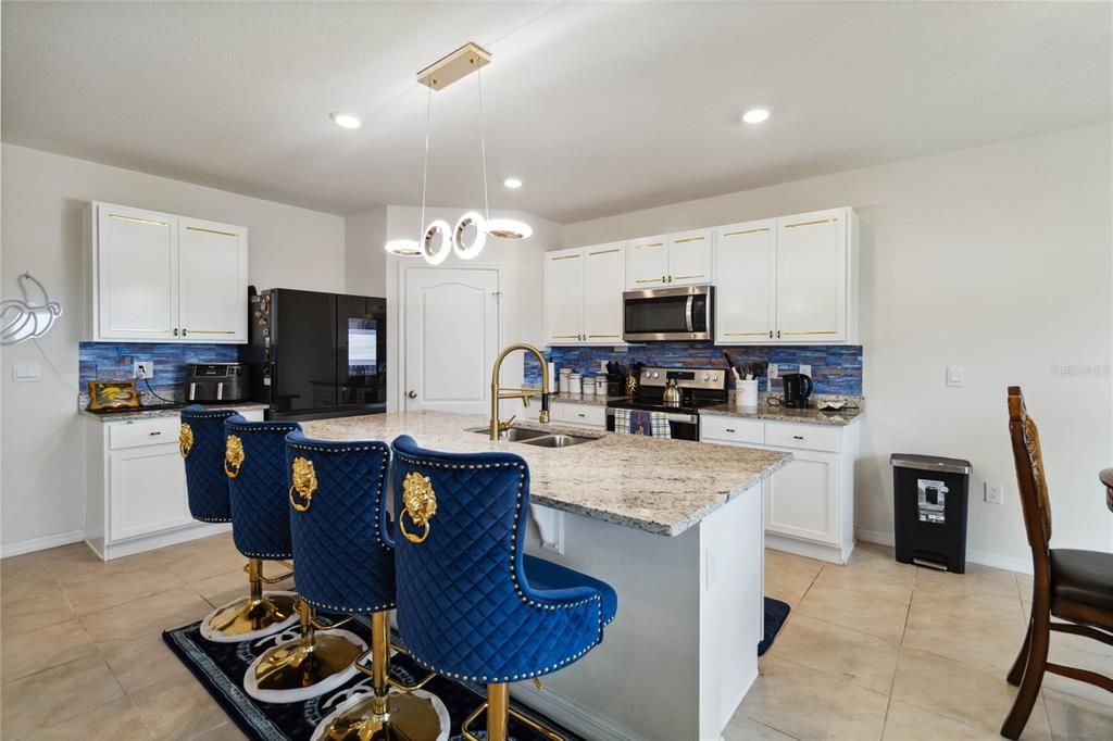 This kitchen island offers tons of space for food prepping, sure to make the family cook happy!