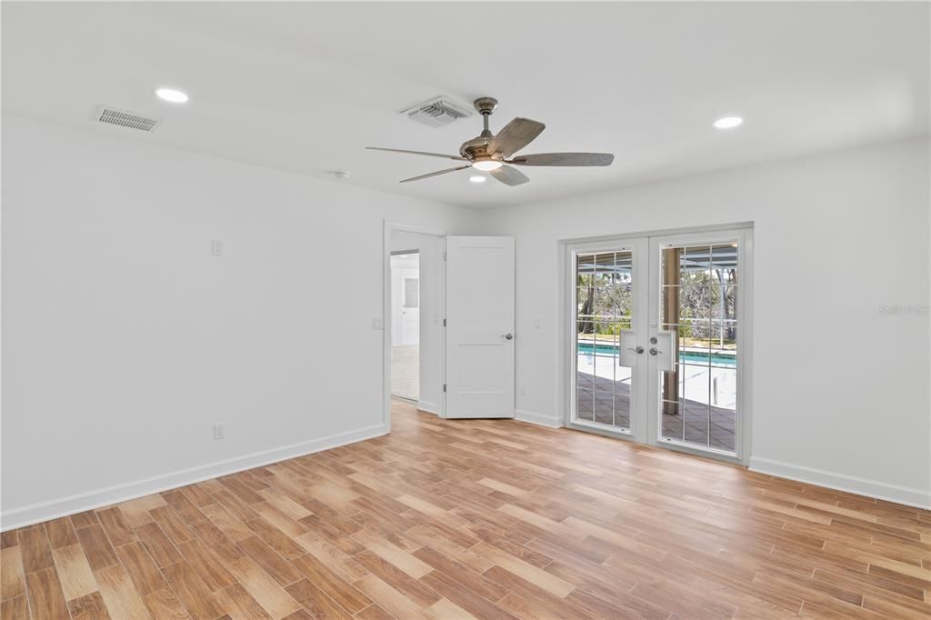 Master bedroom is split from guest bedrooms and has a double french door exit to the patio.