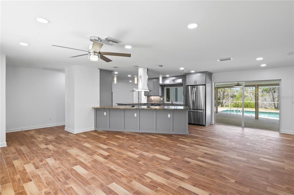 Family-friendly kitchen featuring durable granite countertops, easy-to-clean surfaces, and a large breakfast bar for casual meals.