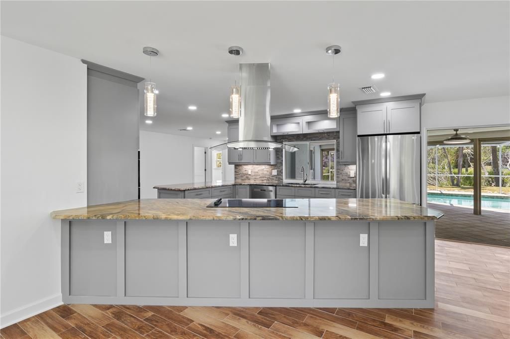 Gourmet kitchen and upgraded countertops, custom backsplash, and high-end fixtures, perfect for culinary enthusiasts and entertainers.