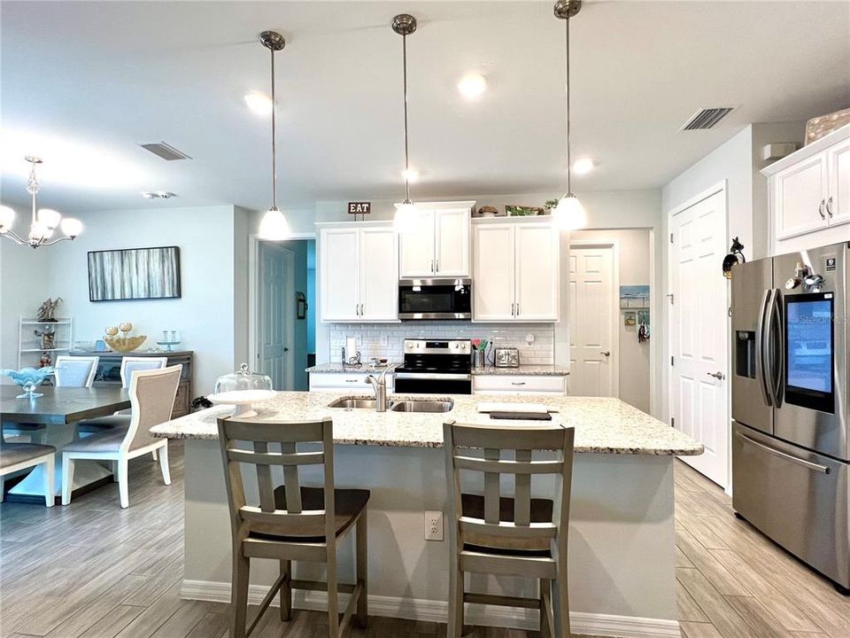 Gorgeous coastal kitchen with staggered upper cabinets