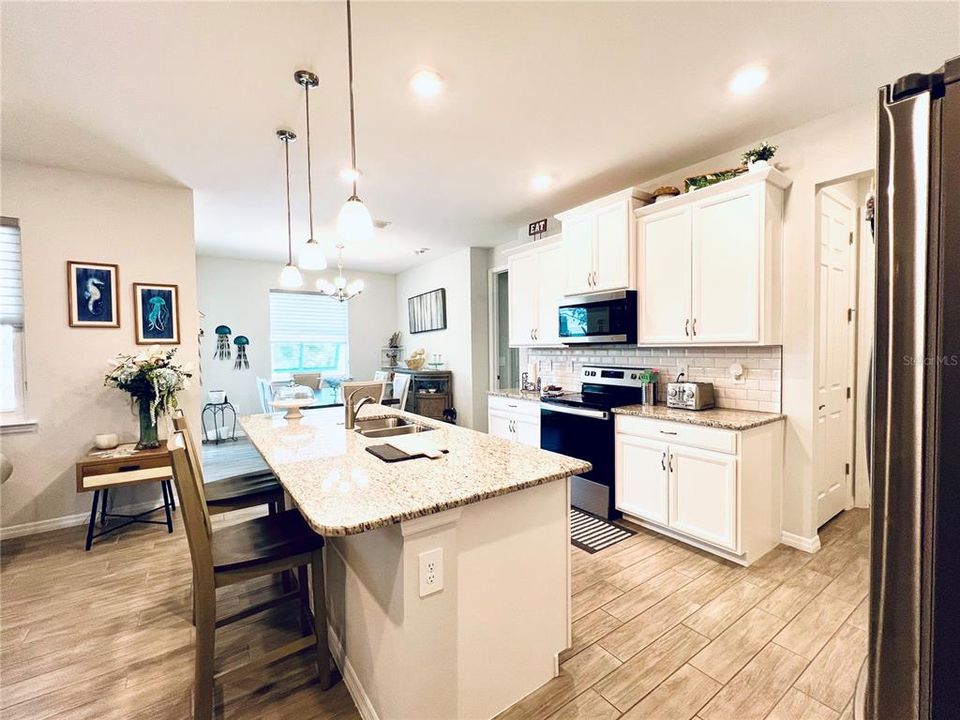 Lovely pendant lighting and granite counters