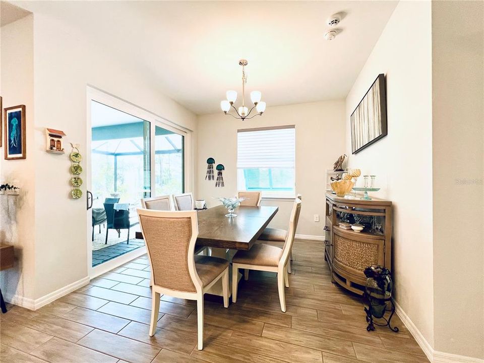 Dining room with 2024 upgraded sliders to the MASSIVE patio