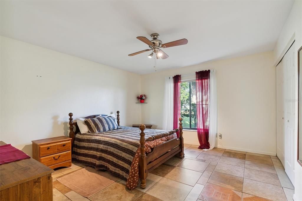 Bedroom 2 with tile flooring