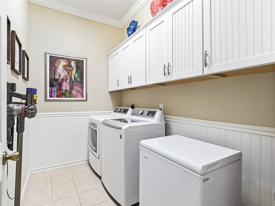 Inside laundry w/Extra cabinets & Stand up freezer