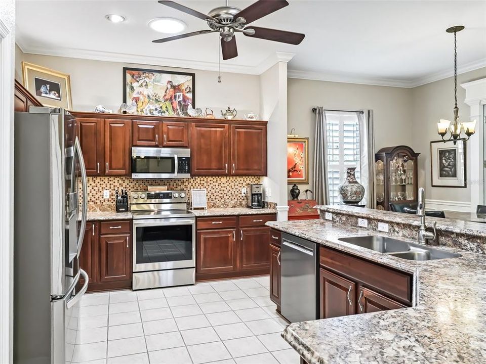 Kitchen w/Stainless appliances & Crown molding