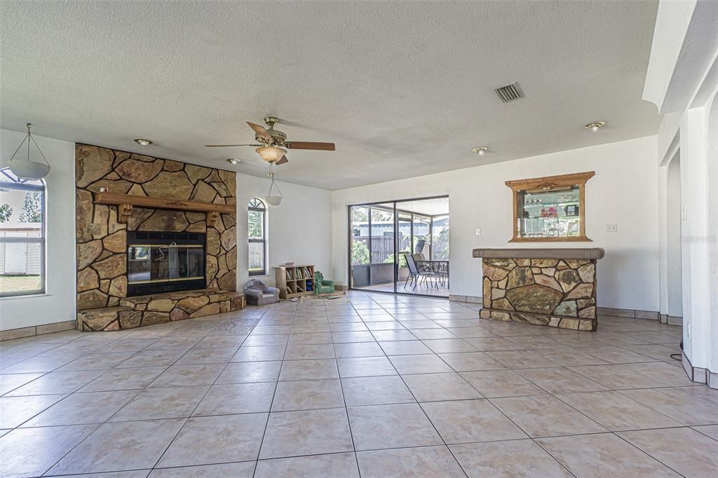 Family room with fireplace and custom dry bar.