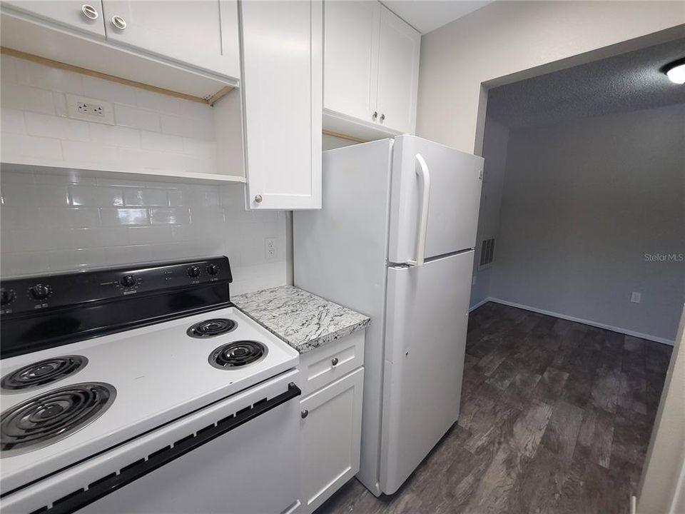 Shelf over the stove to house a countertop microwave