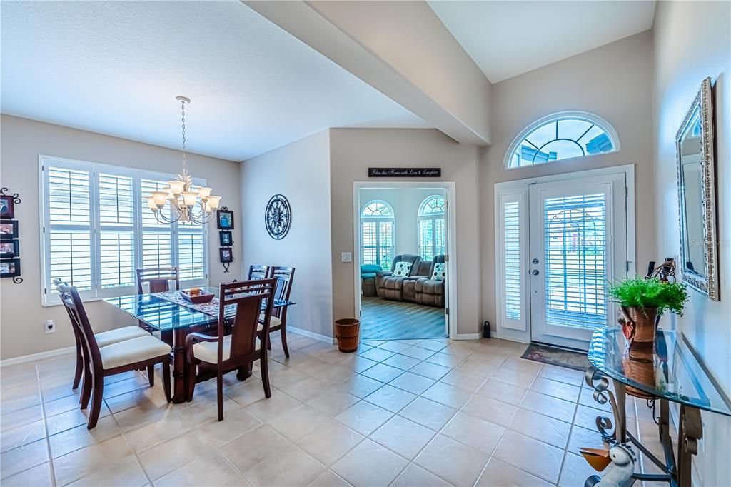 View from entryway into the Den/Study and Dining Room on the left