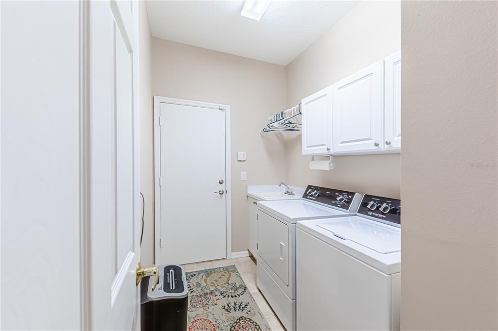 Laundry Room with sink and area to hang clothes