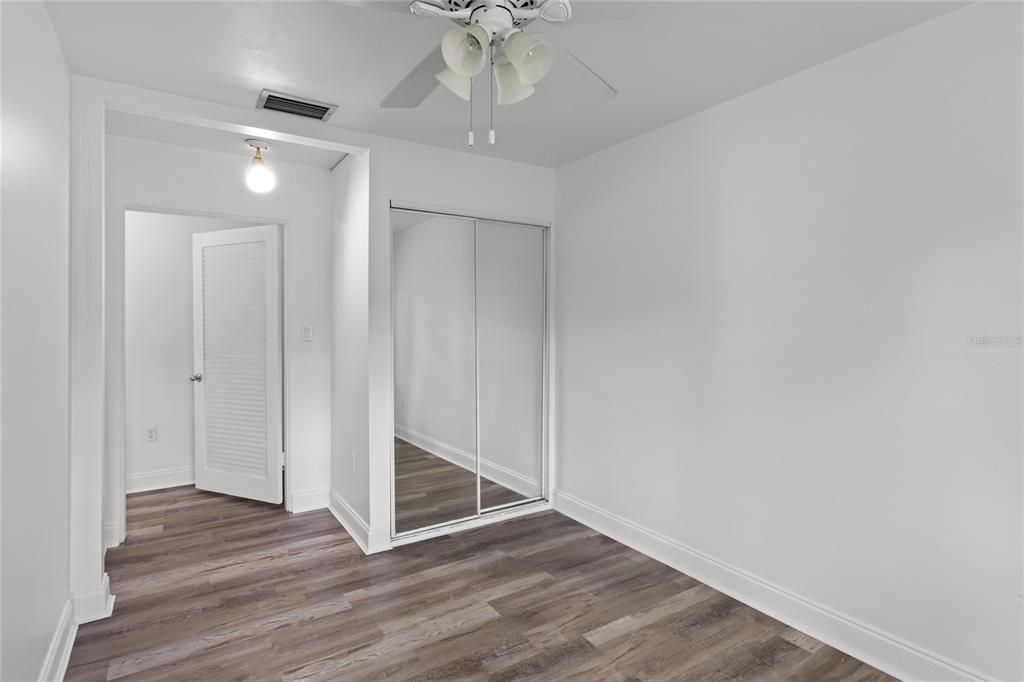 Bedroom #2 features mirrored closet doors