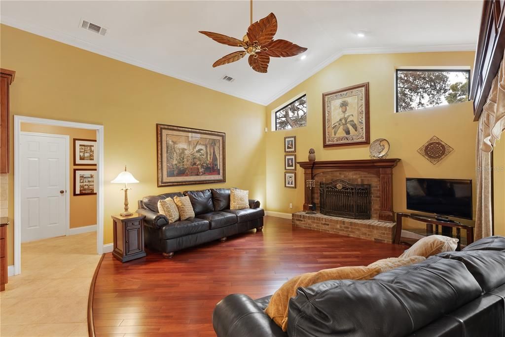 Family room has cathedral ceiling accented with transom windows.