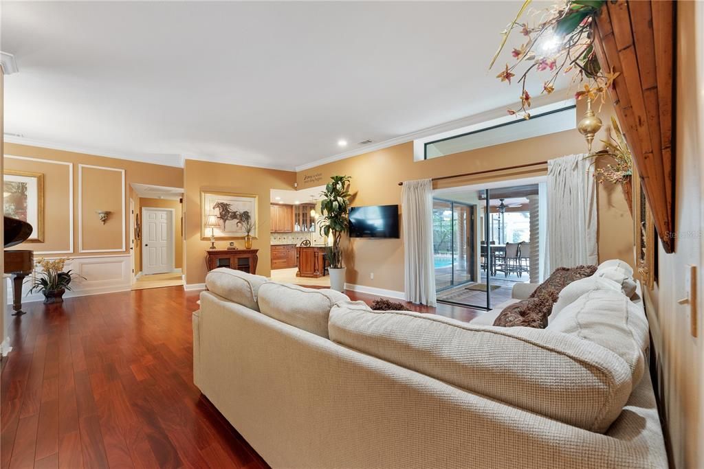 Living room opens to pool and patio.  Sliding doors tuck into a wall pocket out of sight creating an open-air retreat.