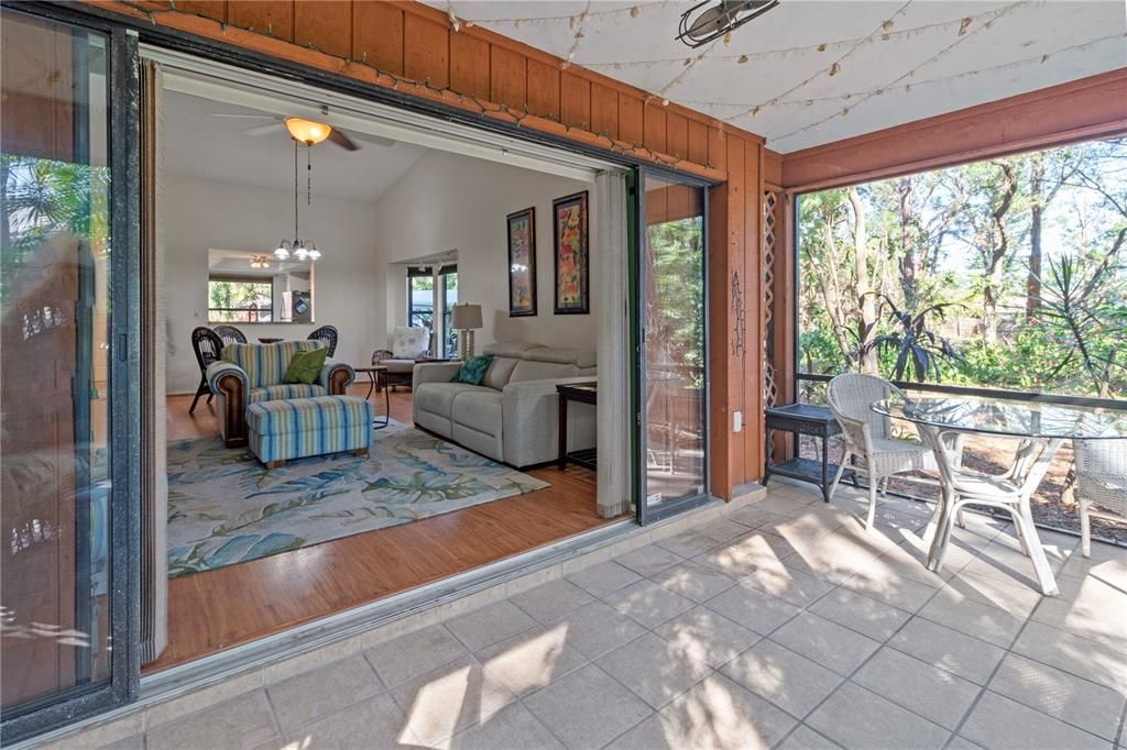 Spacious, screened in patio overlooking the lush back garden