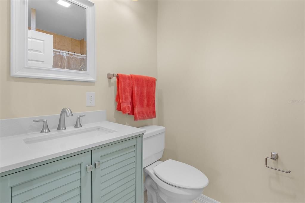 First of 2 bathrooms int he home. This bath features a fully tiled shower a new vanity