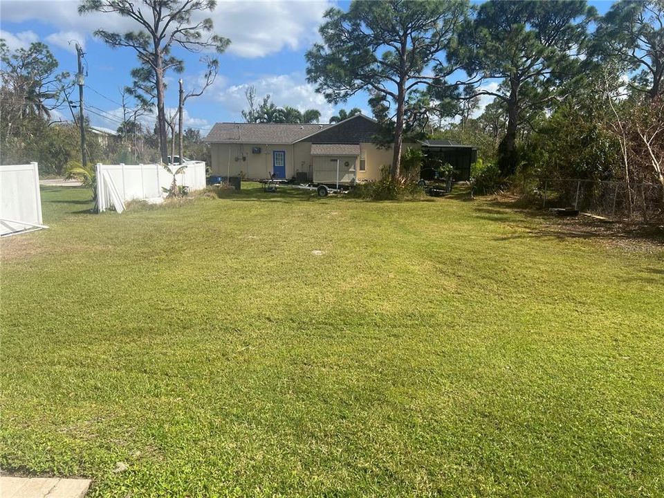 Looking out from the sliding glass door off the kitchen to the big side yard. The possibilities are endless