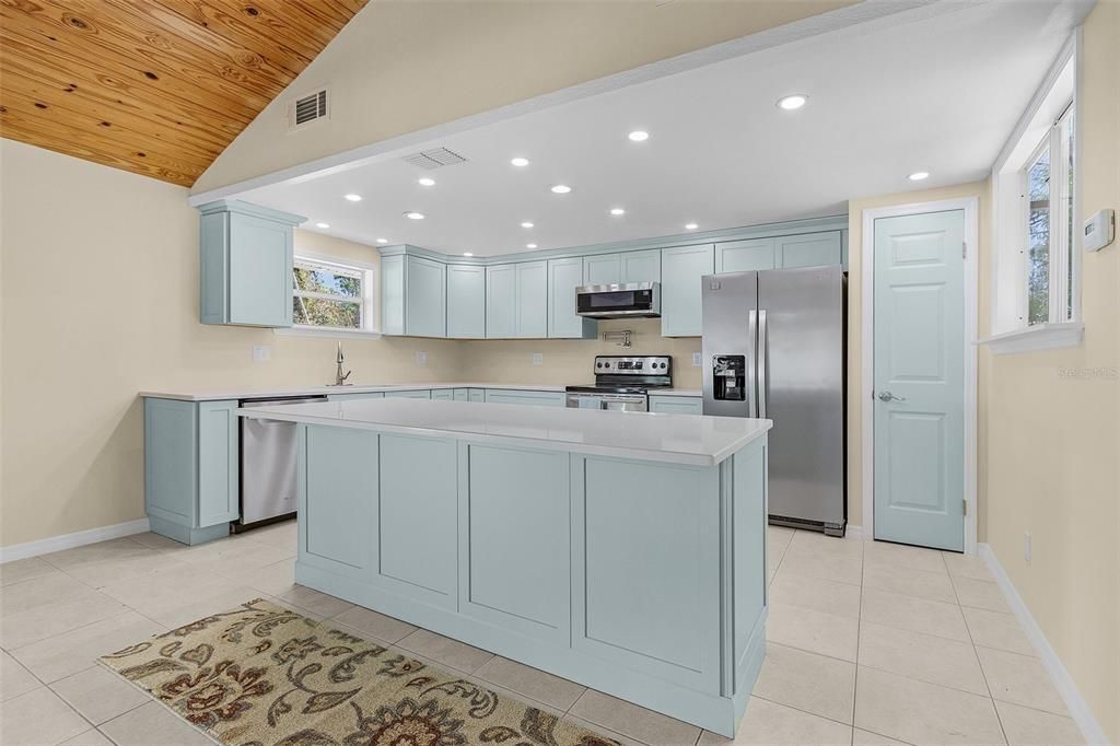 The kitchen features new cabinets, quartz countertops, pantry closet and newer appliances! Just move in and enjoy cooking in this great kitchen area.