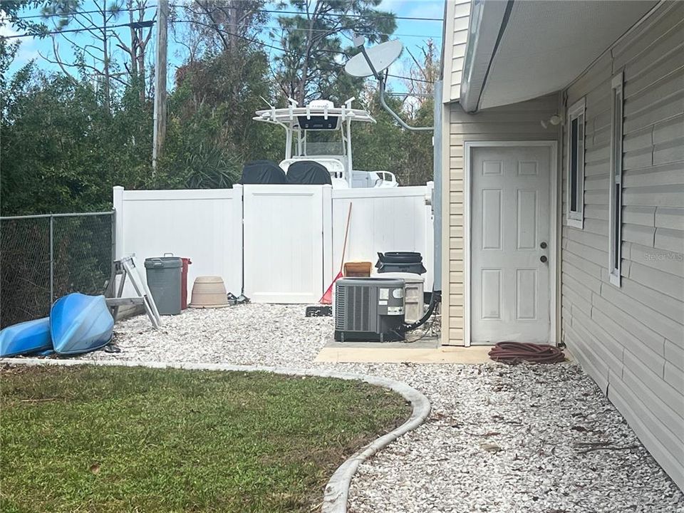 This is on the side on the house. Great for storage of some water toys and is totally fenced in. Could be used for a dog run.