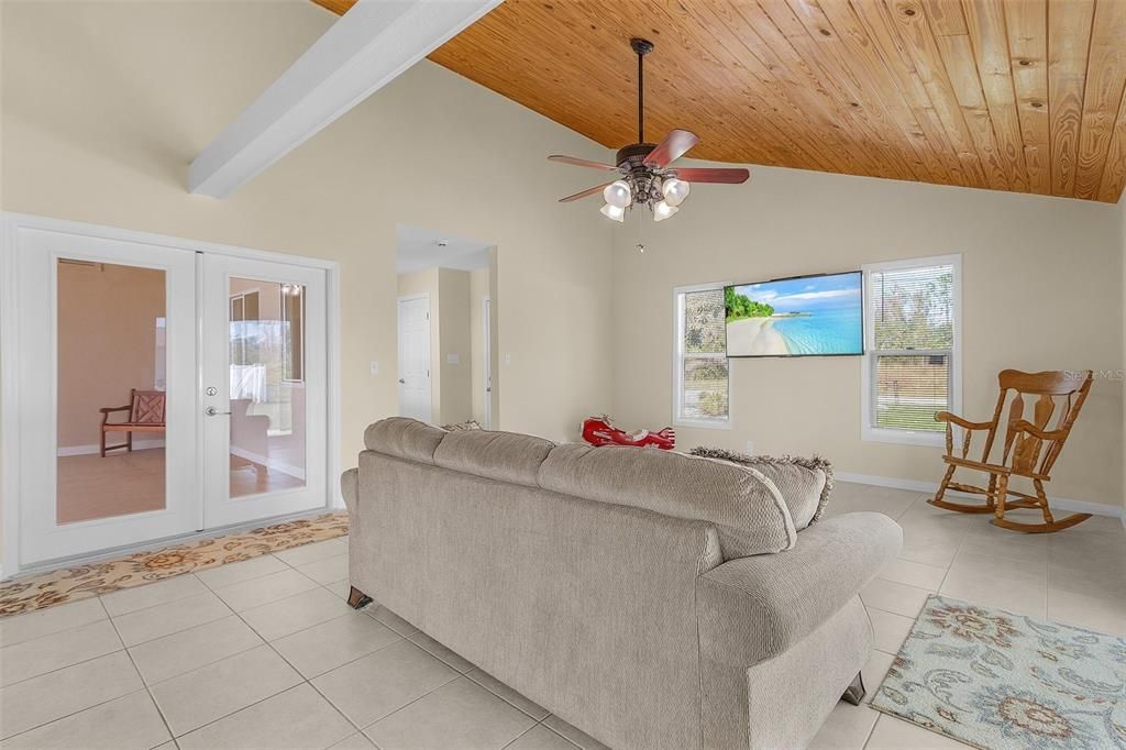 One one side of the family room you have doors that lead out to the HUGE atrium and on the other side you have doors that lead out to the fenced in side yard