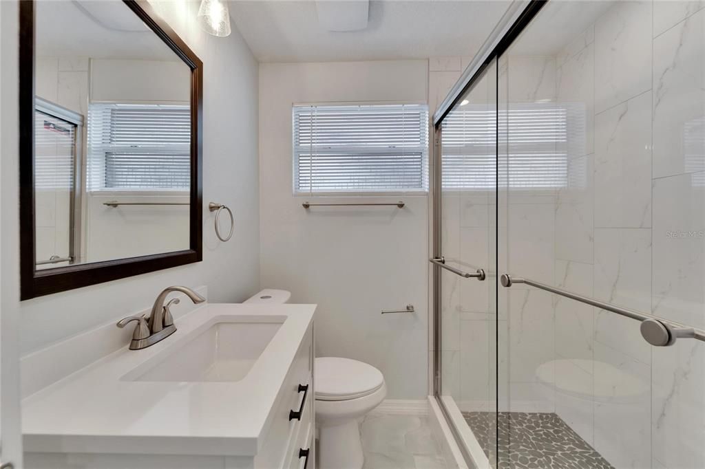 2nd bathroom with new shower and vanity.