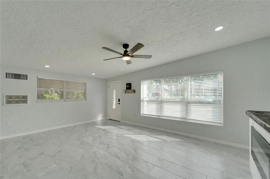 Family room with electric fireplace.