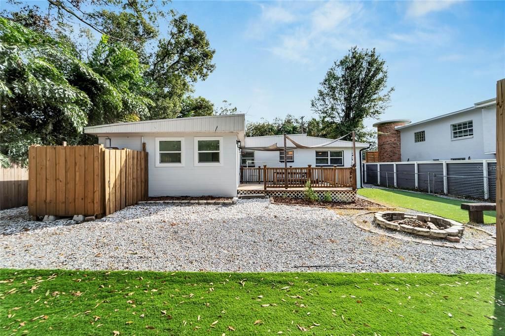 Backyard oasis with an outdoor shower and many areas to relax & unwind.