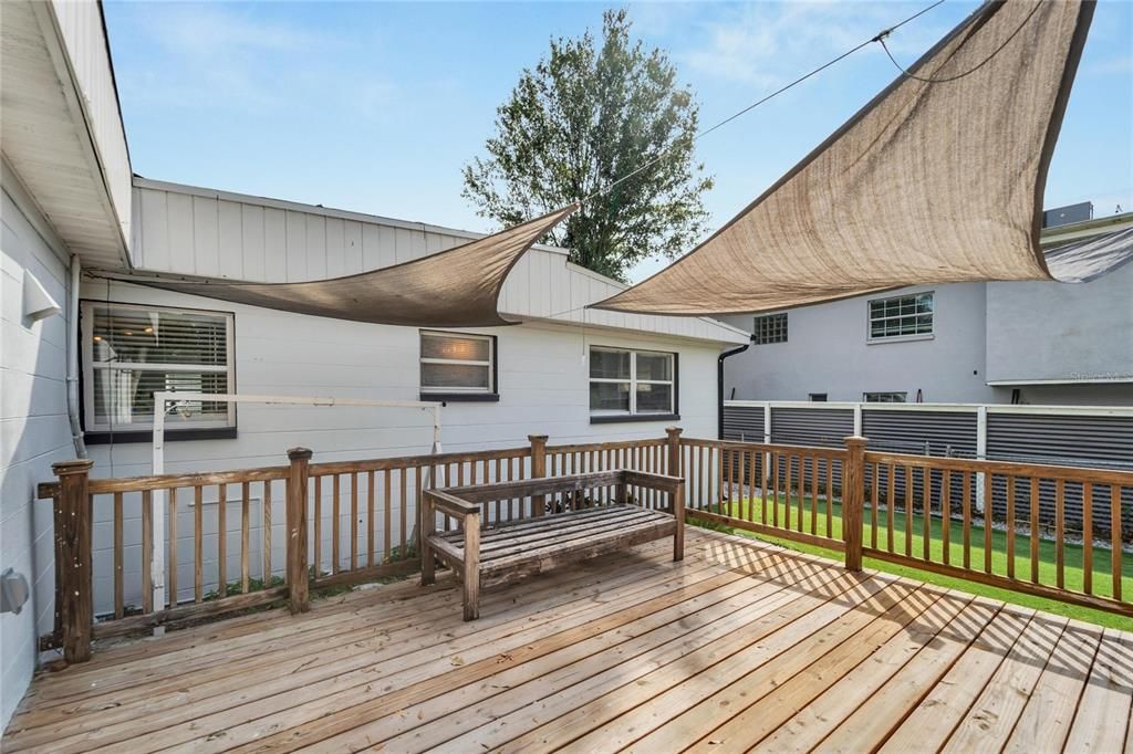 Backyard oasis with an outdoor shower and many areas to relax & unwind.