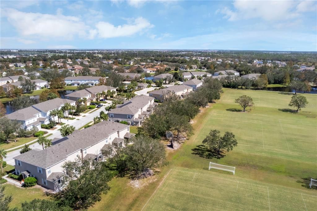 Sports fields and park located behind the home.