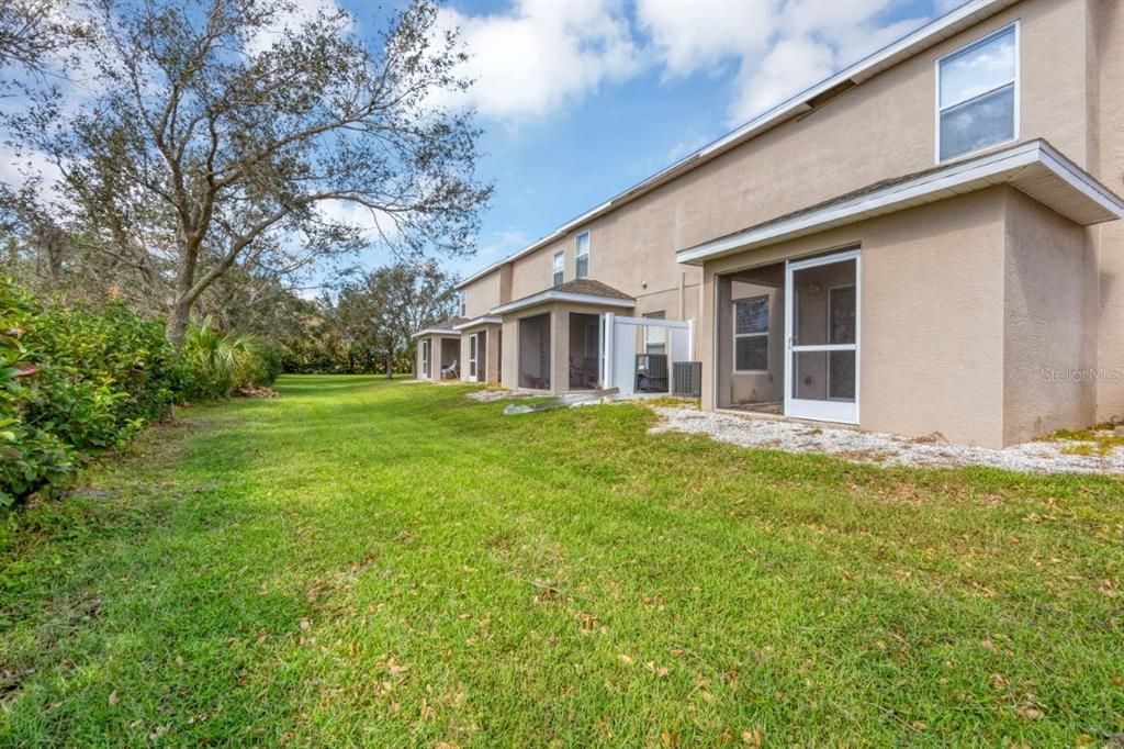 Spacious semi-private backyard.